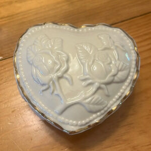 Porcelain heart shaped trinket box with gold tone trim and roses on top